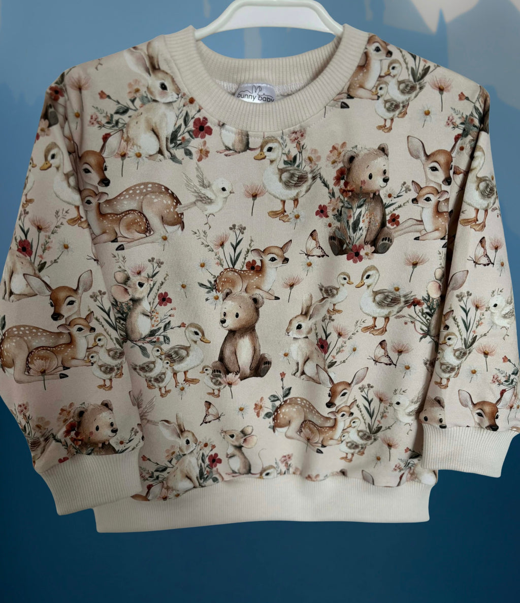 Bluza w wiosenne zwierzątka w pastelowym odcieniu